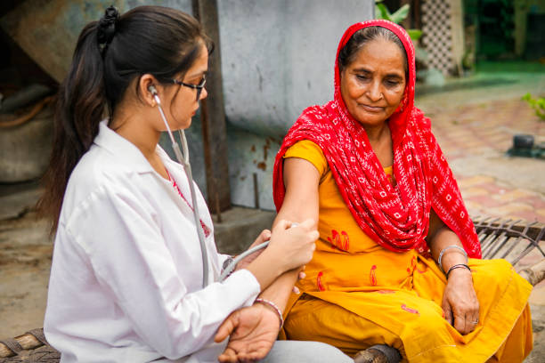 Doctor checking patient blood pressure