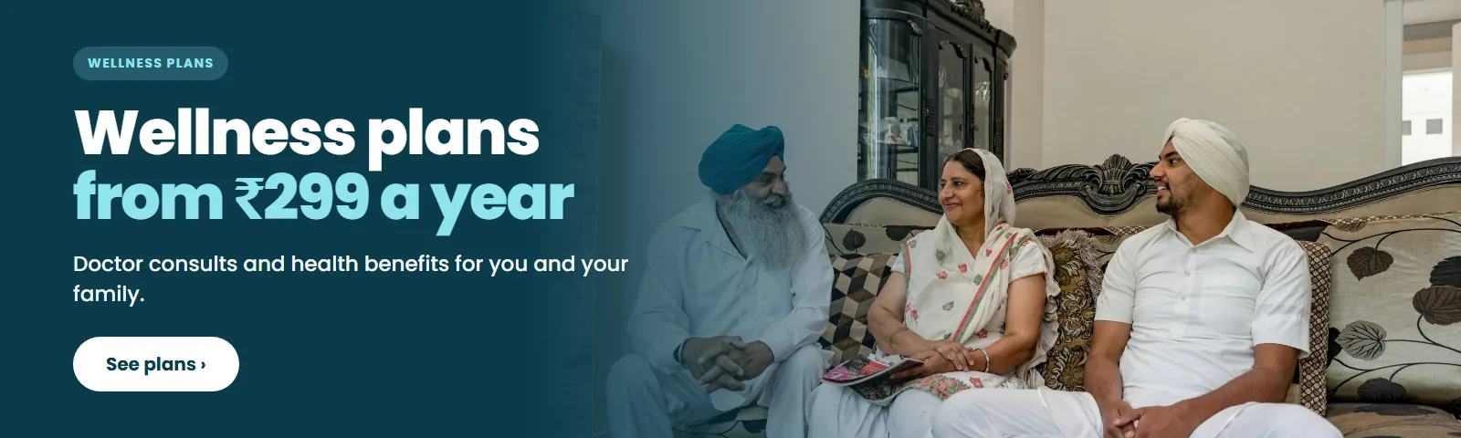 An Indian family on a sofa. Wellness plans from 299 rupees a year.
