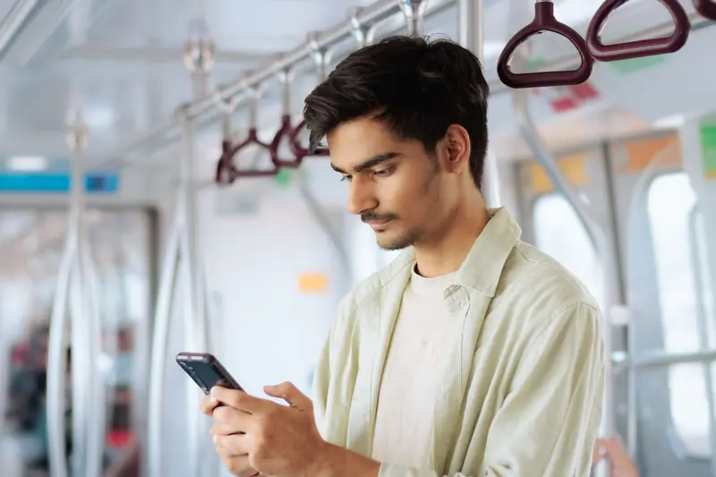 Illustrative scene: a woman looking at her phone