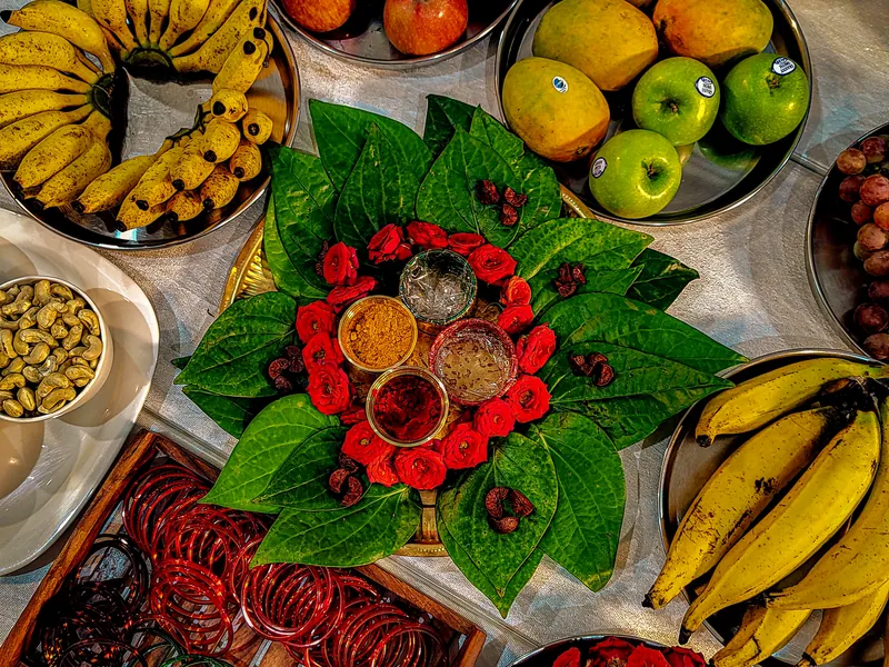 Illustrative scene: a platter of fresh fruit and traditional foods seen from above