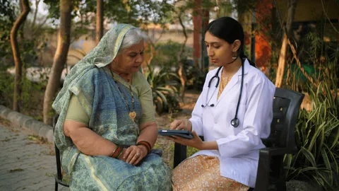 Doctor consulting patient with tablet
